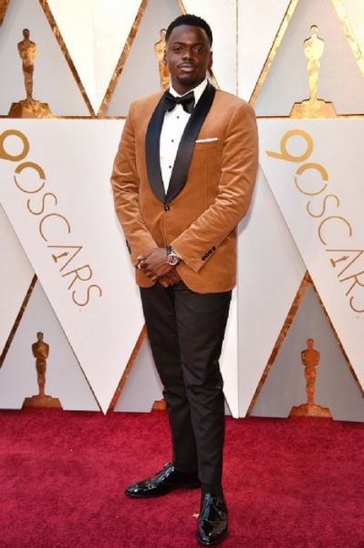 Daniel Kaluuya, nominee for Best Actor, in an elegant brown dinner jacket by Brunello Cucinelli Image