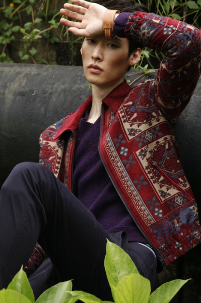 Jacket with sweater and pants, all by Etro; Leather cuff by Hermès; Gommino moccasins by Tod’s Image