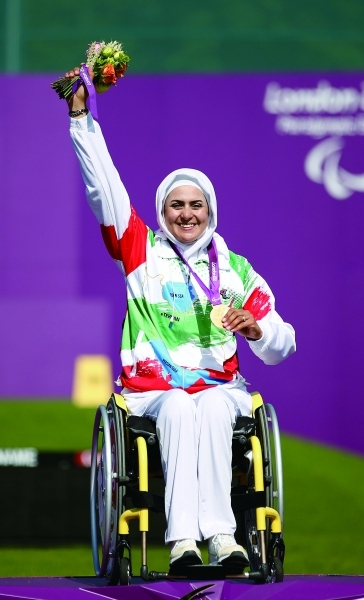 LONDON, ENGLAND - SEPTEMBER 04: Zahra Nemati of the Islamic Republic of Iran receives her Gold medal after winning the Women's Individual Recurve - W2 category on day 6 of the London 2012 Paralympic Games at The Royal Artillery Barracks on September 4, 2012 in London, England. (Photo by Harry Engels/Getty Images)